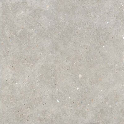 Baldosa porcelánica glamstone grey con textura de hormigón y motas de colores