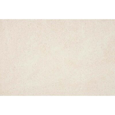 Primer plano de una baldosa porcelánica rectangular Bellevue Ivory, que muestra una textura fina de efecto piedra en un color marfil uniforme.