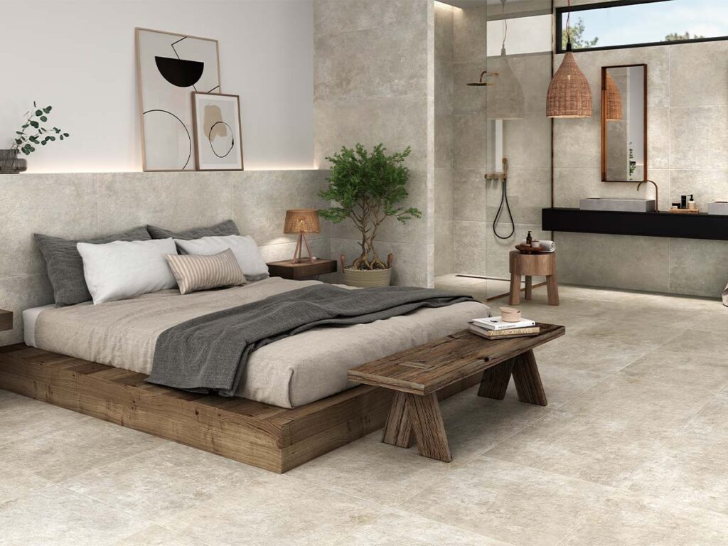 Pavimento interior de salón con porcelánico Crassana Natural de efecto cemento gris.