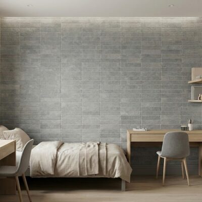 Pared de dormitorio con azulejos efecto piedra tosca gris. Consulta piedra tosca precio.