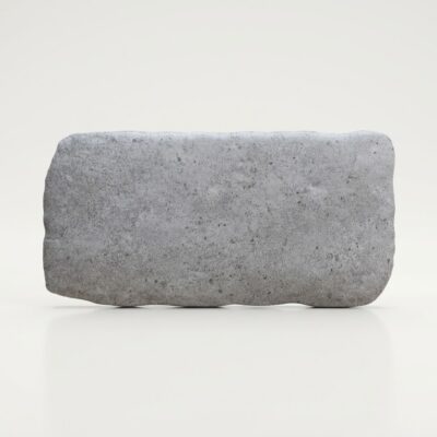 Baldosa cerámica Benisa gris efecto piedra con bordes irregulares sobre fondo claro.