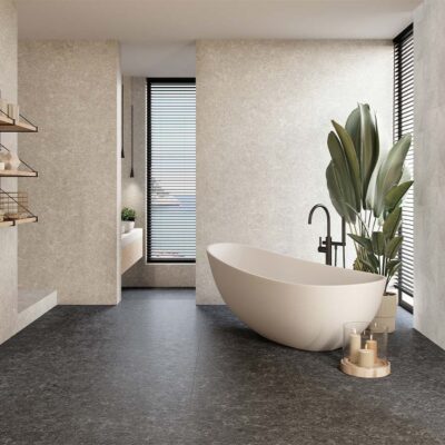 Suelo de un salón moderno pavimentado con porcelánico Verity Anthracite, que recrea la textura de la piedra en un elegante color gris antracita.