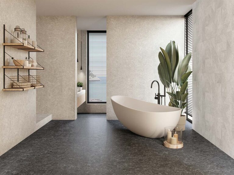 Suelo de un salón moderno pavimentado con porcelánico Verity Anthracite, que recrea la textura de la piedra en un elegante color gris antracita.