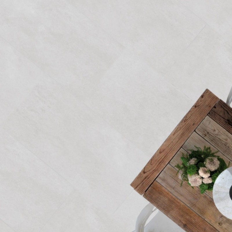 Salón de estilo industrial con suelo porcelánico de imitación cemento pulido