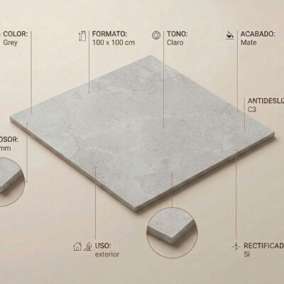 Pieza rectangular de gres porcelánico de 100×100 cm en color gris claro con textura imitación piedra natural, acabado mate y rectificado, con borde biselado de 10 mm de grosor.