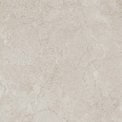 Baldosa porcelánica beige con acabado mate e imitación piedra caliza, ideal para suelos y revestimientos interiores de estilo contemporáneo.