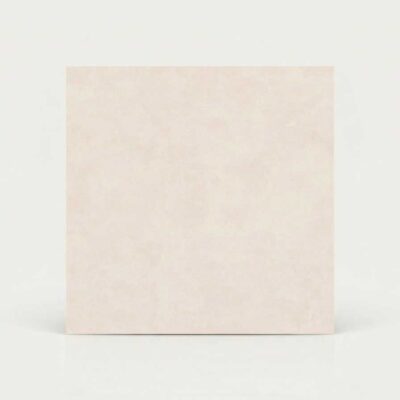 Azulejo suelo porcelánico beige crema con textura de efecto cemento.
