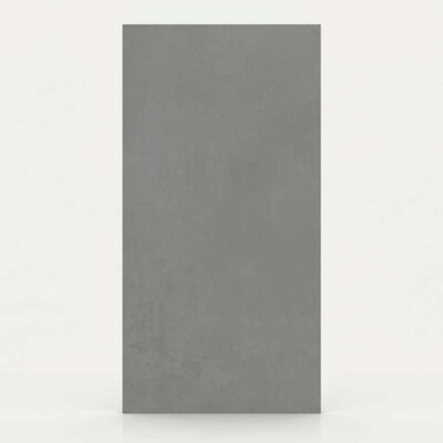 Un azulejo porcelánico rectangular gris marengo con textura de cemento