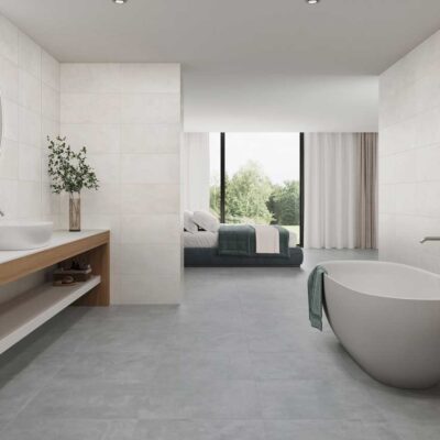 Amplio baño con azulejos Columbia Pearl en paredes y suelo porcelánico gris oscuro.