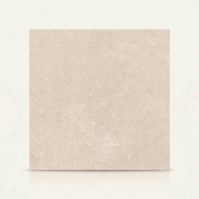 Baldosa rectangular de porcelánico beige claro con textura de piedra natural.
