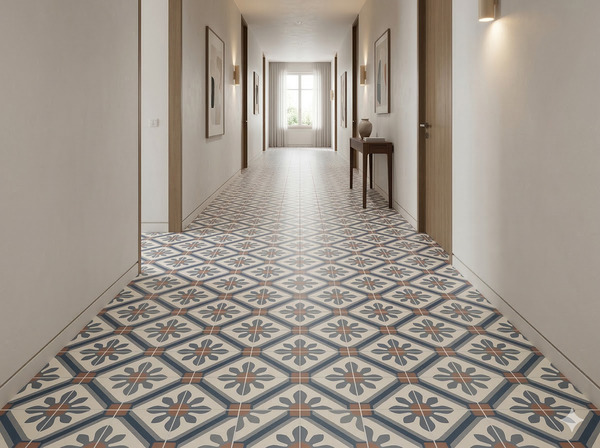 Un pasillo largo con suelo porcelánico de azulejos hidráulicos. Las paredes son blancas
