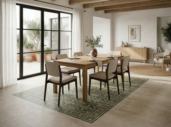 Suelo con azulejos hidráulicos porcelánicos en verde dispuestos a modo de alfombra cerámica en zona de comedor