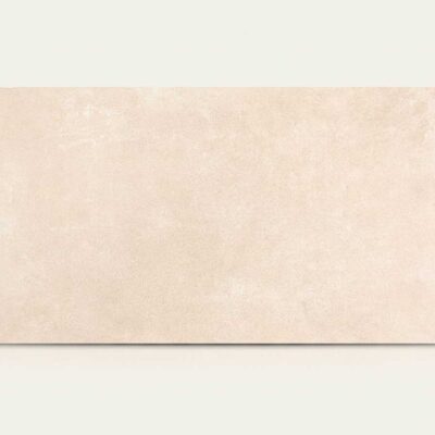 Azulejo porcelánico rectangular crema claro con textura sutil de cemento.