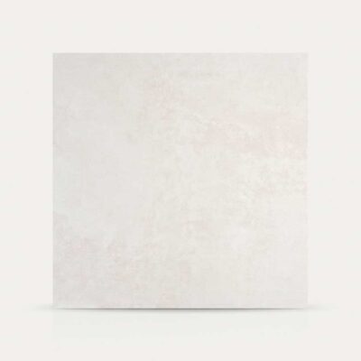 Un azulejo porcelánico Balance Grey de color gris claro con textura de cemento.