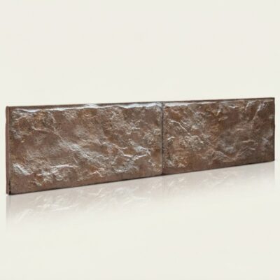 Dos piezas rectangulares de azulejo cerámico con textura rústica en tonos marrón cálido y acabado mate rugoso, mostrando superficie irregular característica del efecto piedra natural.