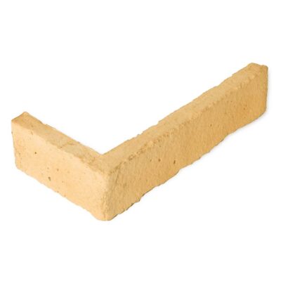 Pieza angular de aplacado hormigón con acabado rústico imitación ladrillo en tonos cálidos beige y ocre, formato esquina para revestimiento de pared interior y exterior.