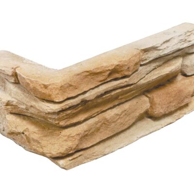 Pieza de revestimiento con formato irregular y bordes rústicos en tonos beige y cobrizo, con textura de piedra natural y acabado mate rugoso.