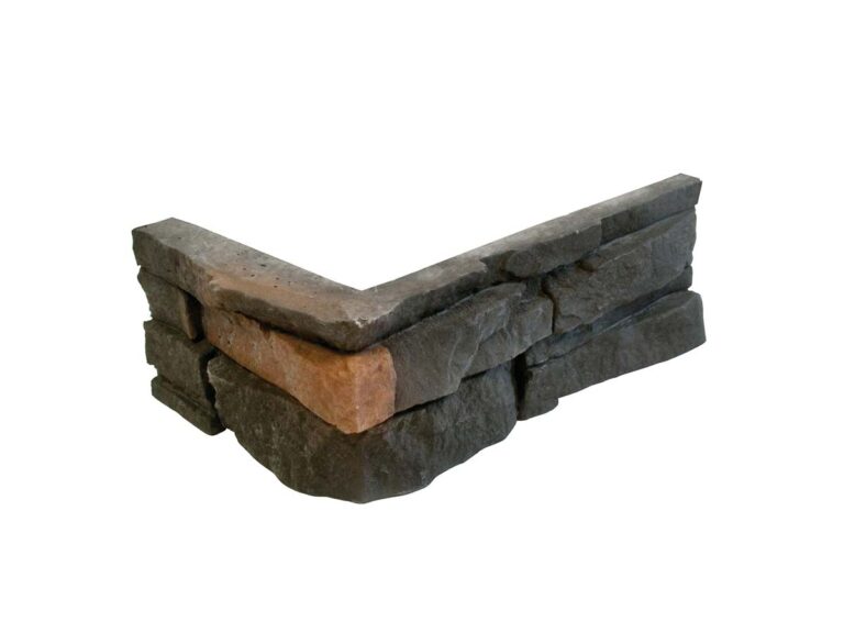 Pieza de esquina en aplacado hormigón imitación piedra con acabado rugoso en tonos grises y detalles oxidados. Formato angular para remate de esquina exterior o interior.