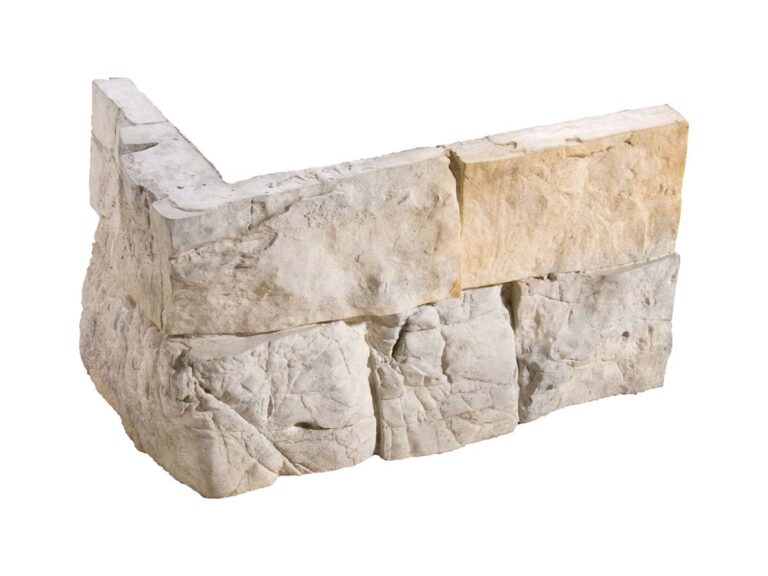 Esquina de aplacado con textura de piedra natural en tonos grises y beige, superficie rugosa con acabado mate y efecto piedra irregular montada.