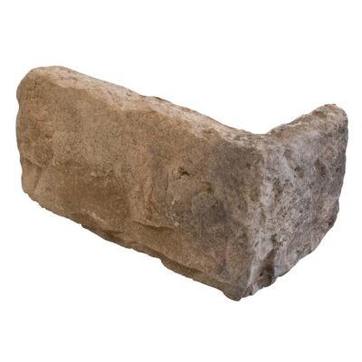 Pieza irregular de aplacado hormigón con imitación piedra en tonos beige y gris, acabado rústico texturizado y superficie áspera.