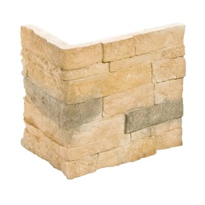 Aplacado de hormigón en tonos castaños y beige con textura de piedra natural irregular. Piezas rectangulares apiladas formando una esquina, acabado rústico mate con relieve que simula la mampostería de piedra.