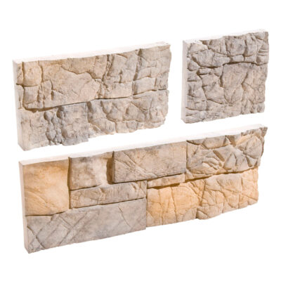 Tres muestras de aplacado de hormigón con textura de piedra natural en tonos beige y crema. Las piezas presentan acabado rústico con relieve irregular y variaciones cromáticas que imitan la mampostería de piedra.