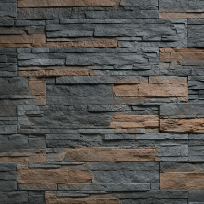 Muro interior revestido con panel de piedra laminada en tonos grises y marrones cálidos, con acabado texturizado y formato de piezas rectangulares de diferentes tamaños colocadas en patrón irregular para crear profundidad y contraste visual.