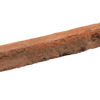 Pieza rectangular de hormigón con textura de ladrillo rústico en tonos terracota y marrón, acabado mate con relieve característico de mampostería tradicional.