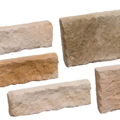 Conjunto de cinco piezas de aplacado con textura rústica en tonos beige, tostado y gris, acabado rugoso natural imitando piedra corteza. Formato rectangular e irregular, bordes irregulares característicos del estilo colorado.