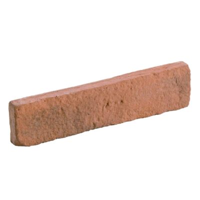 Pieza rectangular de aplacado hormigón con textura rústica imitando ladrillo artesanal, tonos tierra cálidos y acabado mate rugoso.