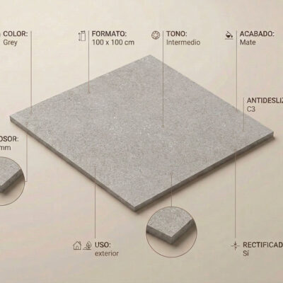 Baldosa porcelánica rectangular de formato 100×100 cm con acabado mate y textura imitación piedra en tonalidad gris intermedio. Superficie con efecto natural y antideslizante, rectificada.