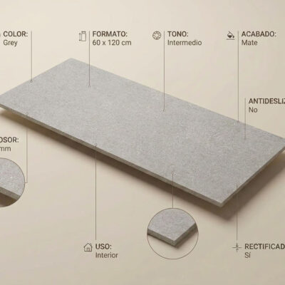 Placa rectangular de porcelánico gris en formato 60×120 cm con textura imitación piedra natural, acabado mate y rectificado, sobre fondo neutro.