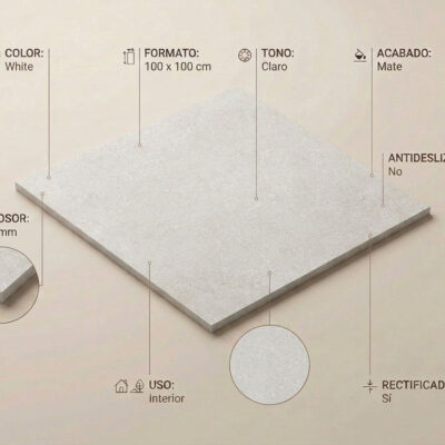 Placa rectangular de gres porcelánico 100×100 cm con acabado mate, color blanco con textura que imita piedra natural, bordes rectificados, grosor de 10 mm visible en detalle ampliado del canto.